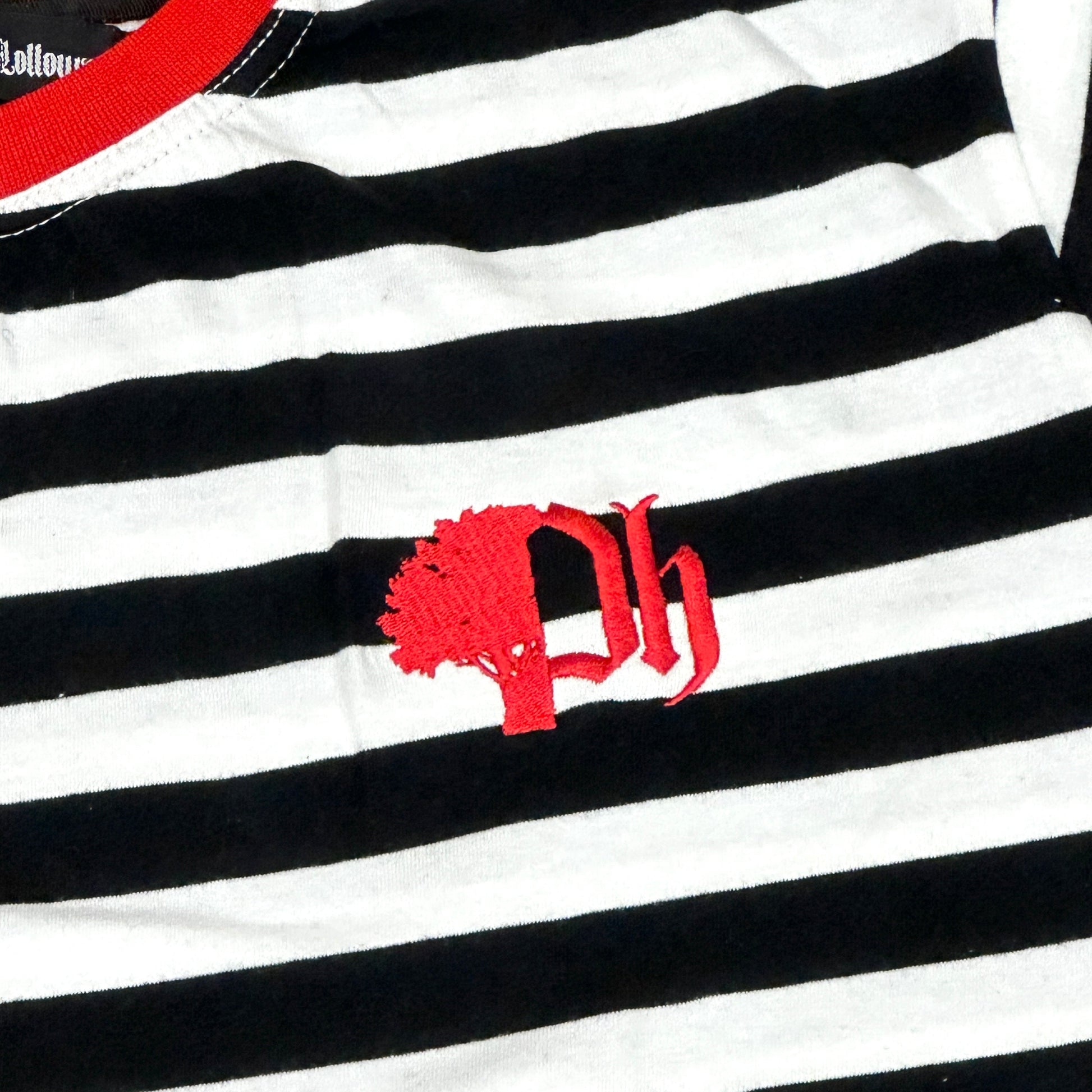 Black and white striped shirt with a red logo on white background.