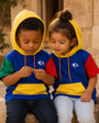 Children wearing Precious Hollows block hoodies in sunlight
