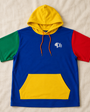 Precious Hollows color-block hoodie laid flat on a cream background