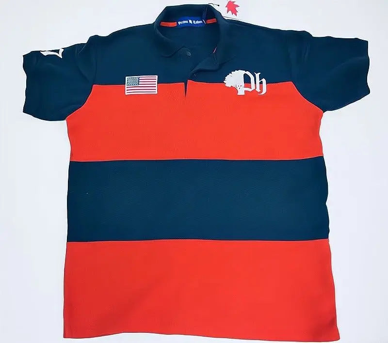 A striped cotton polo shirt with a ribbed collar and armholes, featuring a red and blue color block design, patriotic embroidered details, and a button-up front.#color_navy-stripes