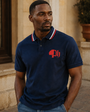 Model wearing the navy Precious Hollows Club Tipped Polo