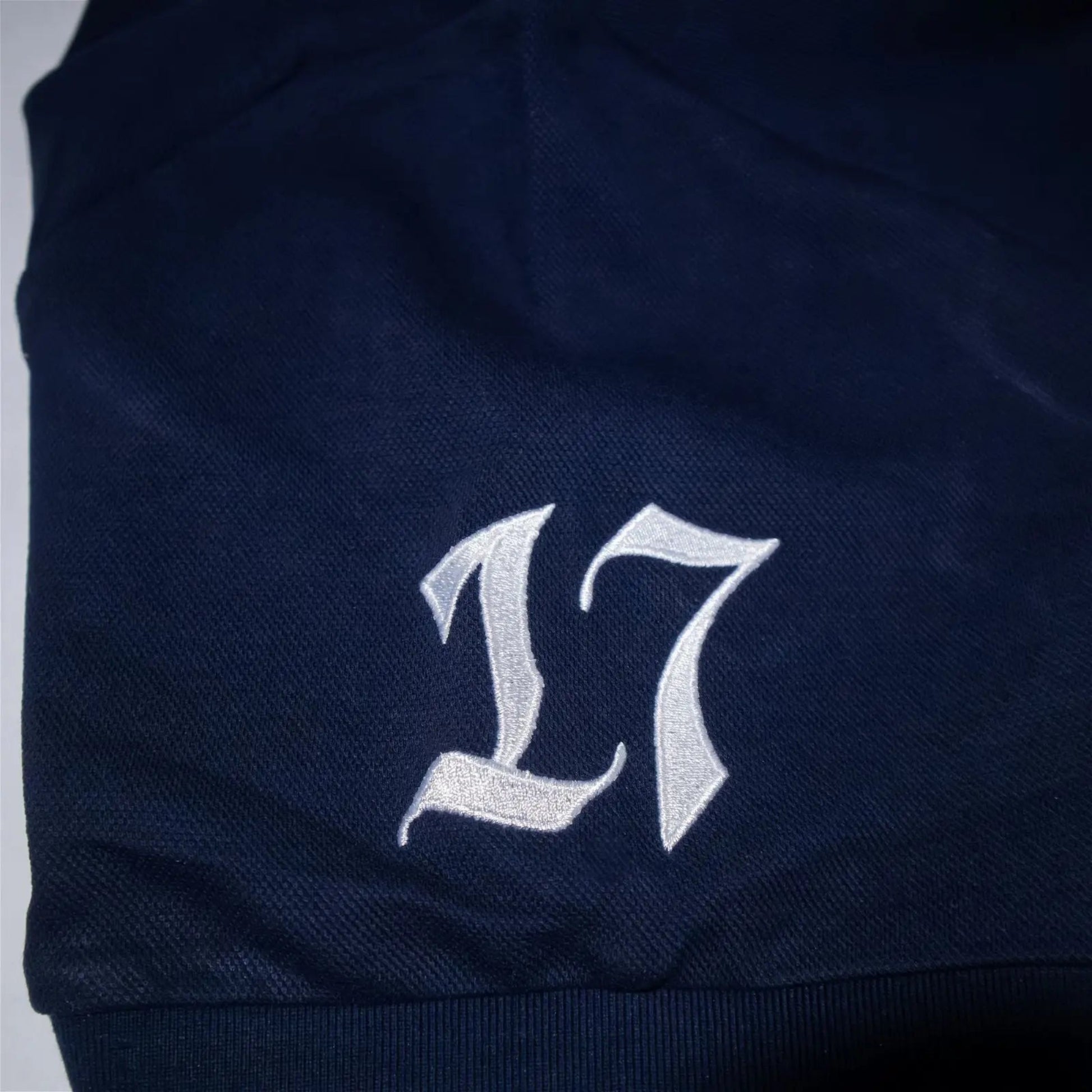 Embroidery image of the number seventeen.#color_navy