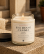 Clean Cotton House Candle styled on a stone ledge