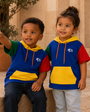 Children wearing Precious Hollows block hoodies on stone steps