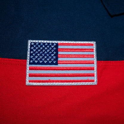 American flag patch on navy blue and red fabric.