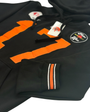 A black cotton blend football hoodie with the number 17 in orange and the brand name Birdie Hollows on it. It includes a hood and features black and white detailing.#color_black