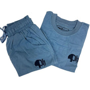 A set of women's clothing including a blue t-shirt and blue shorts, both featuring a small logo on the chest.#color_sky-blue