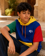 Portrait of a young model wearing the Junior Block Hoodie