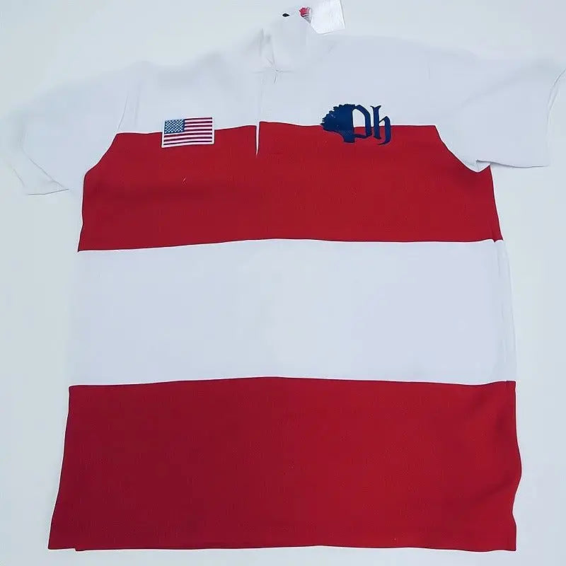 A striped cotton polo shirt with a ribbed collar and armholes, featuring a red and white color block design, patriotic embroidered details, and a button-up front.#color_white-stripes
