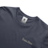 Navy blue t-shirt with 'Precious Hollows' embroidery and a brand label on a white background