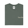 Folded green t-shirt with 'Precious Hollows' text on a white background