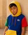 Young model wearing the Junior Block Hoodie in warm sunlight
