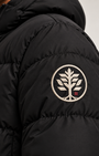 Close-up of a black puffer jacket sleeve featuring a circular embroidered tree logo patch in Off White and Burgundy on the upper arm.